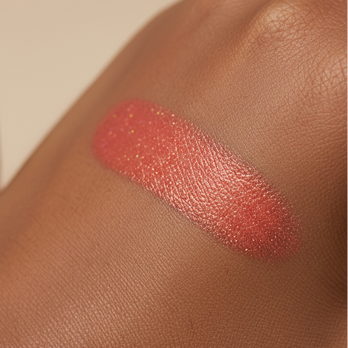 Lipstick swatch on a person's arm with a neutral background