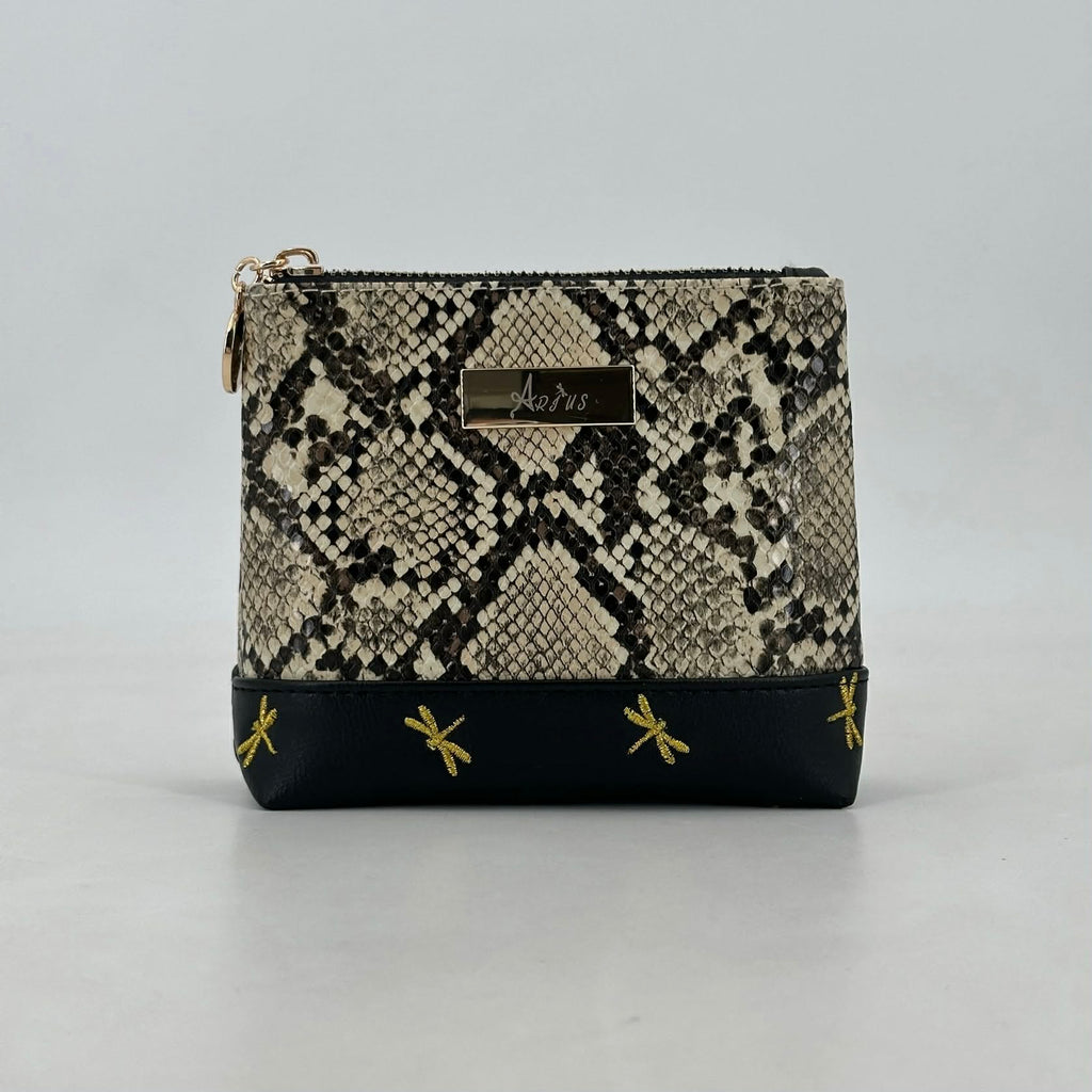 Snakeskin patterned pouch with black base and gold accents on a gray background